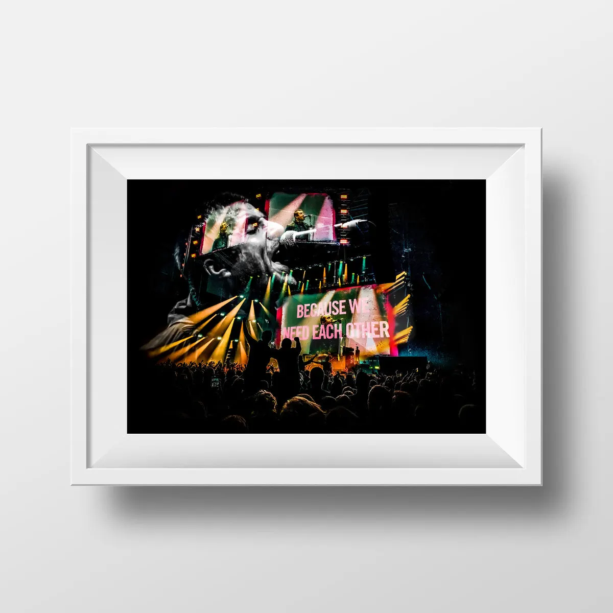 Framed Ricky Atterby photo print of a Liam Gallagher gig, stage lights over the crowd and the words Because We Need Each Other